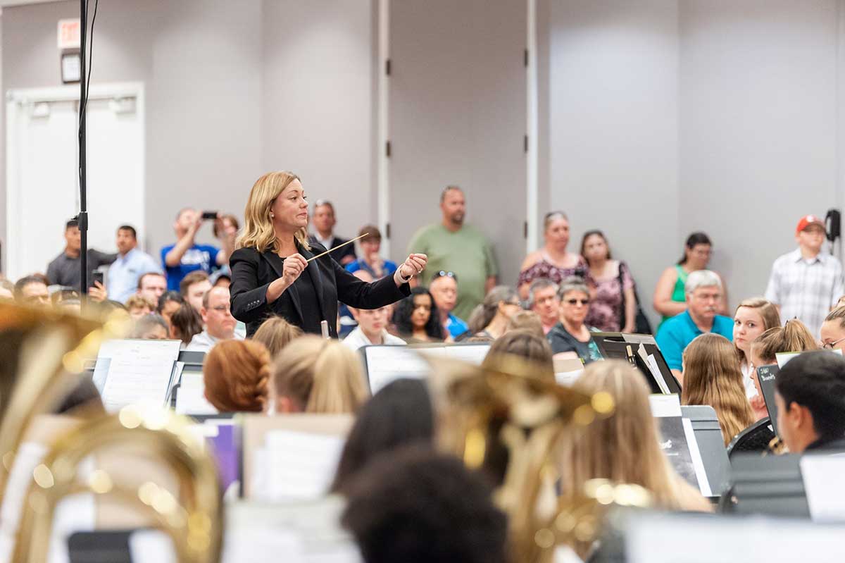 Erin Cole conducting at the Kansas Bandmasters Association.